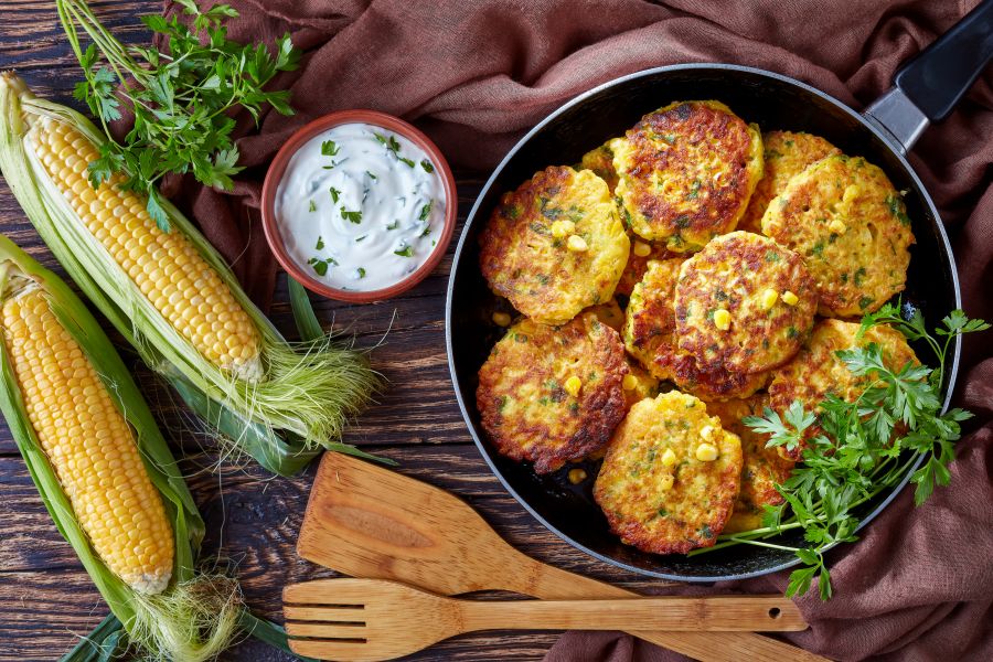Finished product photo for savory corn pancakes with yogurt dipping sauce.
